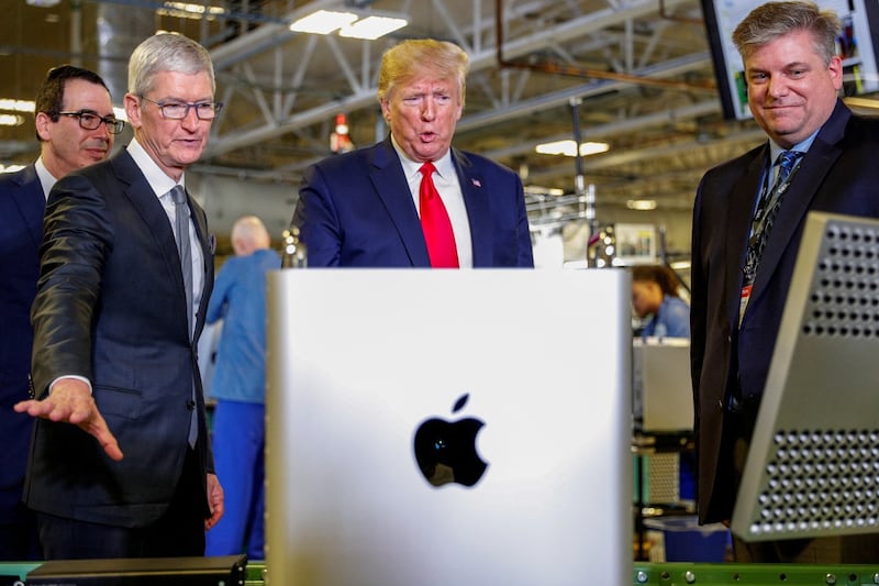 Apple CEO Tim Cook escorts US President Donald Trump as he tours Apple's Mac Pro manufacturing plant in Austin, Texas. Picture: REUTERS/TOM BRENNER
